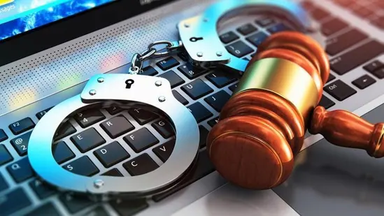 handcuffs and judge mallet on laptop keyboard 9165b4fe c18e 11ea 991f d77957054eff 1727359091029.jpg